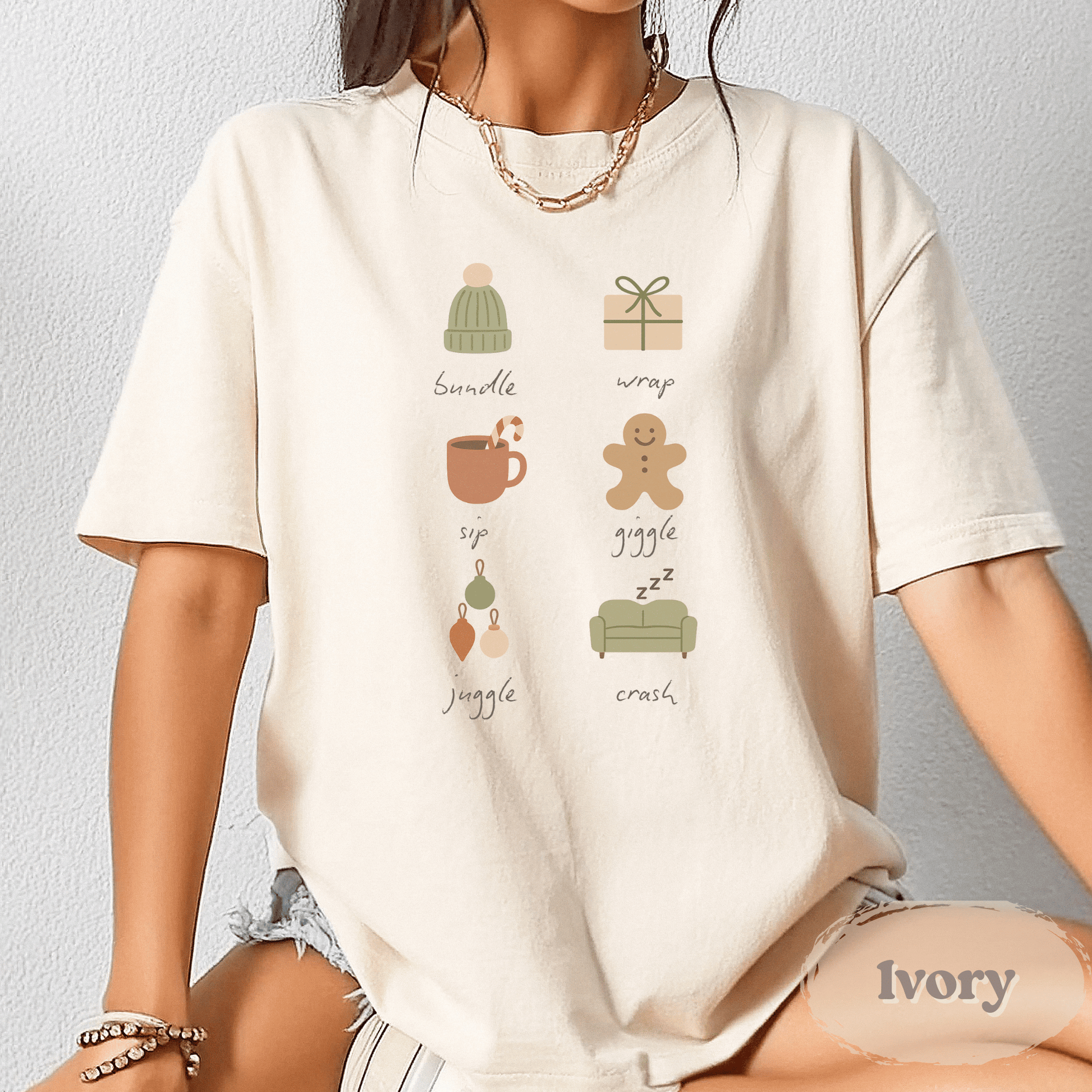 Christmas Holiday Graphic Tee in Ivory – Comfort Colors Shirt for Women with festive holiday icons
