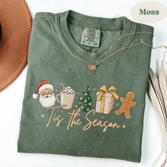 Tis the Season Christmas Shirt Comfort Colors in light green with Santa, cocoa, Christmas tree, gift, and gingerbread design