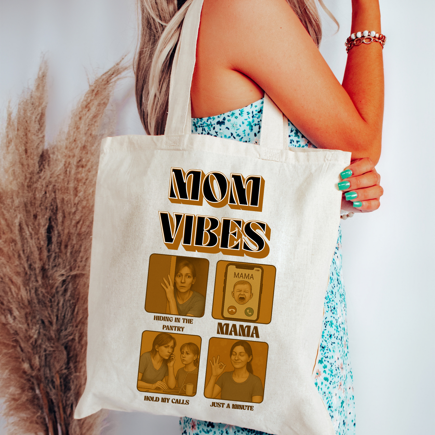 Woman holding Mom Vibes Tote Bag featuring funny retro mom-life graphics, reusable cotton canvas tote bag perfect for moms and Mother’s Day

