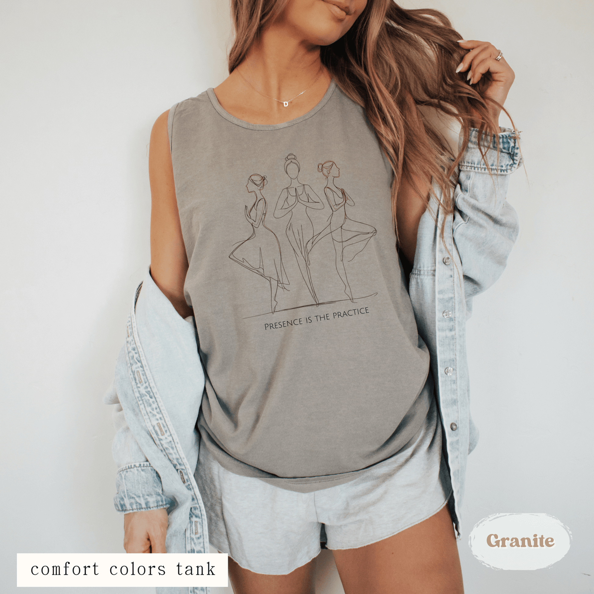 Woman wearing Presence Is the Practice Yoga Tank Top – minimalist line art design on ivory Comfort Colors tank