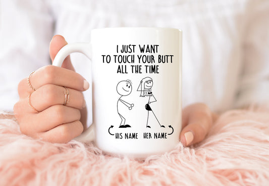 Funny personalized couples mug with stick figures and the phrase “I just want to touch your butt all the time,” customized with his and her names.

