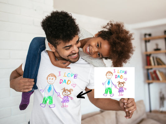 Custom Dad Shirt With Kids Drawing – Personalized Father’s Day Gift featuring child’s crayon artwork printed on a Bella+Canvas white tee, dad carrying daughter

